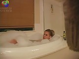 Sexy blond girl caught playing with herself in the bath